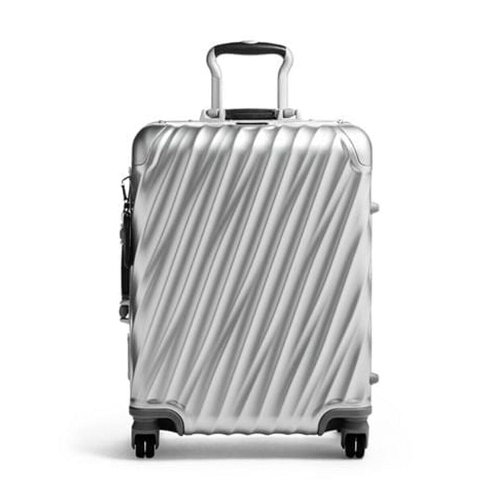 Silver suitcase with black handle and wheels on a white background