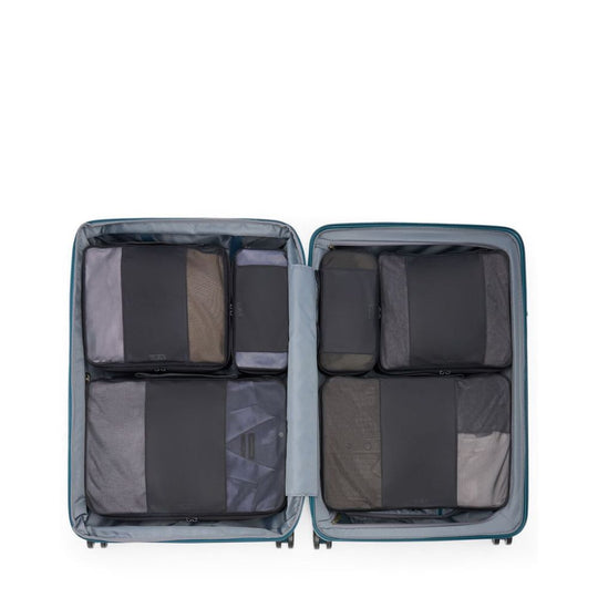 Open suitcase with compartments on a white background
