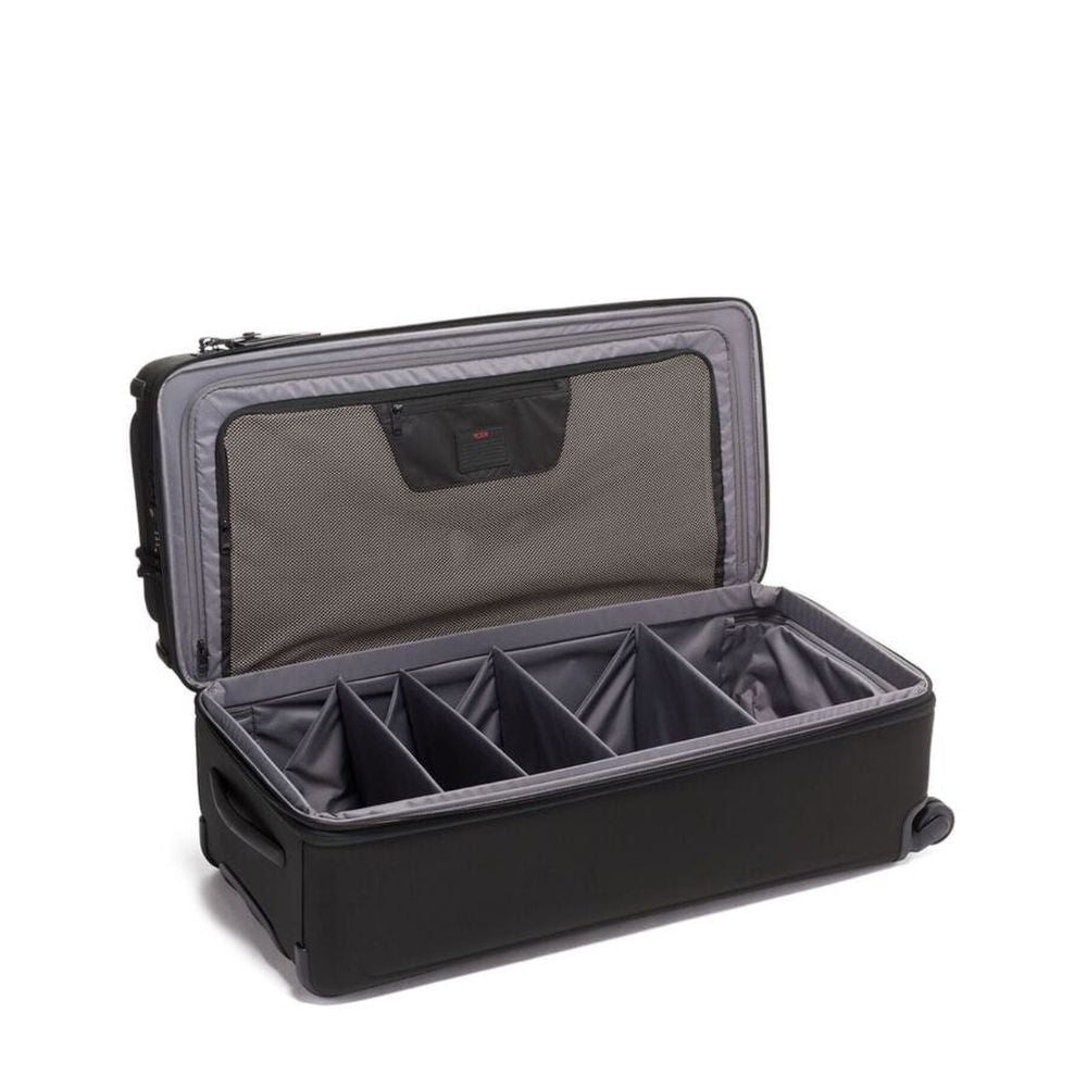 Black suitcase with interior compartments on a white background