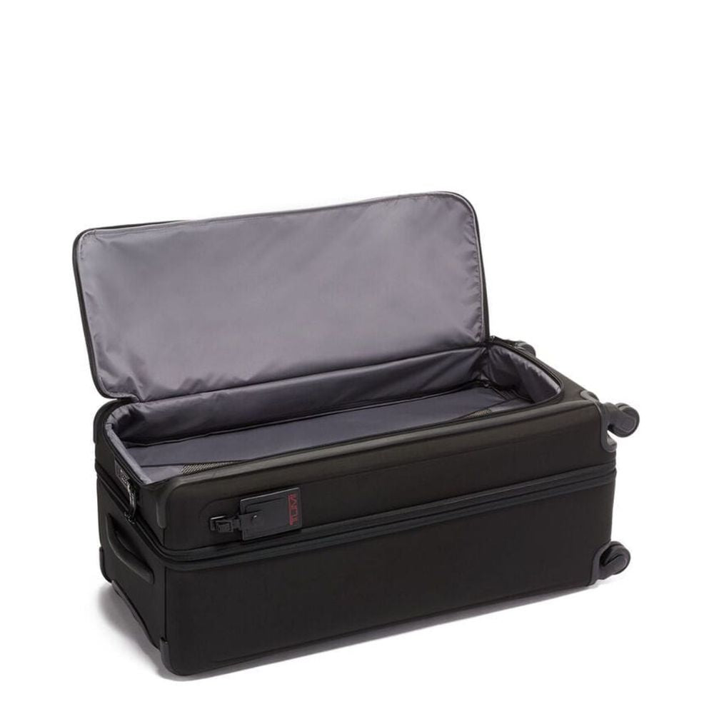 Black suitcase with open lid on a white background