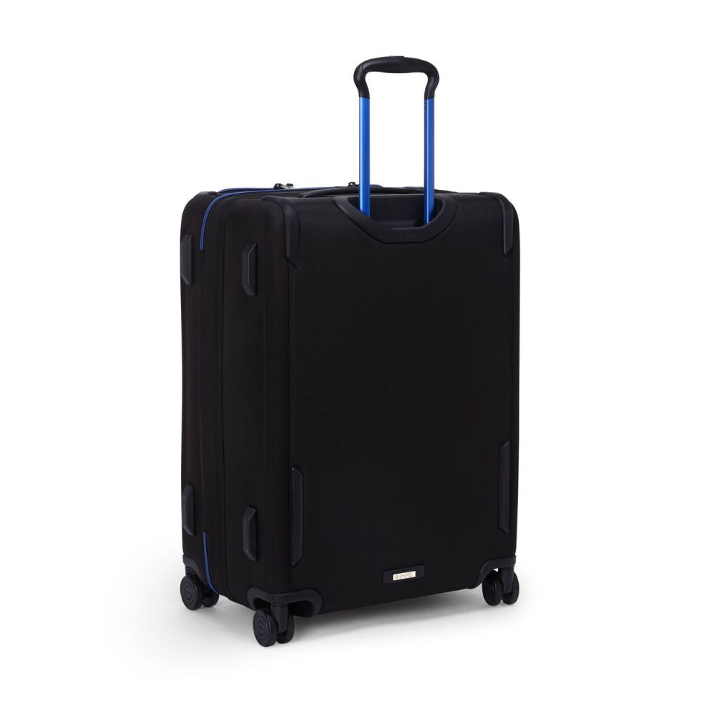 Black suitcase with blue handle on a white background