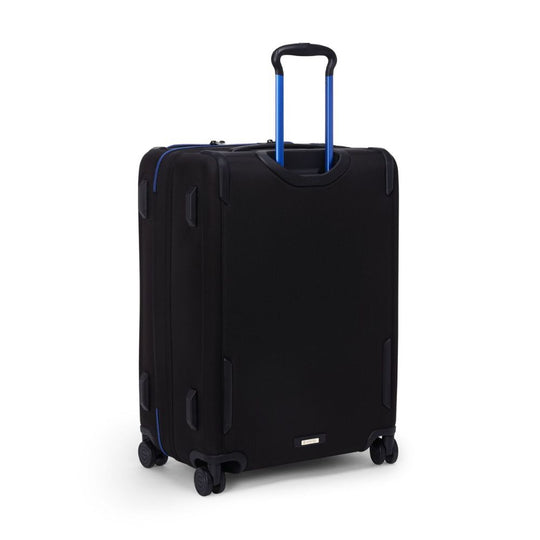 Black suitcase with blue handle on a white background