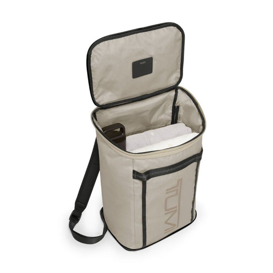Open beige cooler bag with black interior and shoulder strap on a white background