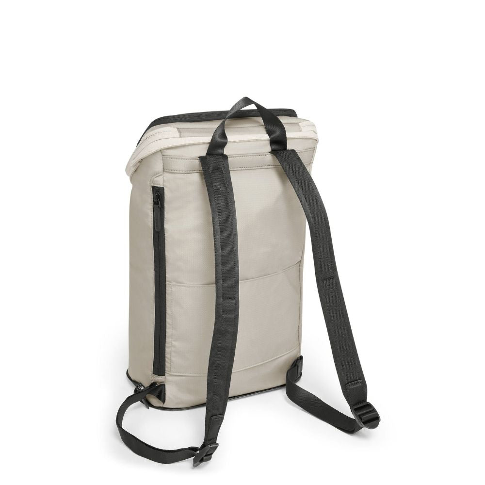 Beige backpack with black straps on a white background