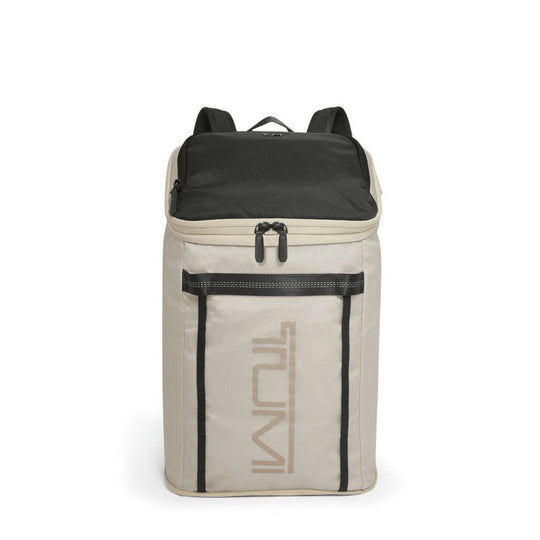 Beige and black backpack with 'TUMI' branding on a white background