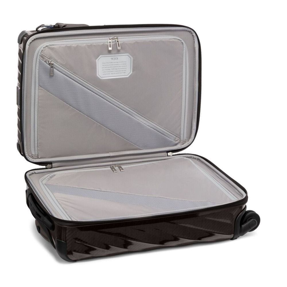 Open suitcase with transparent interior on a white background