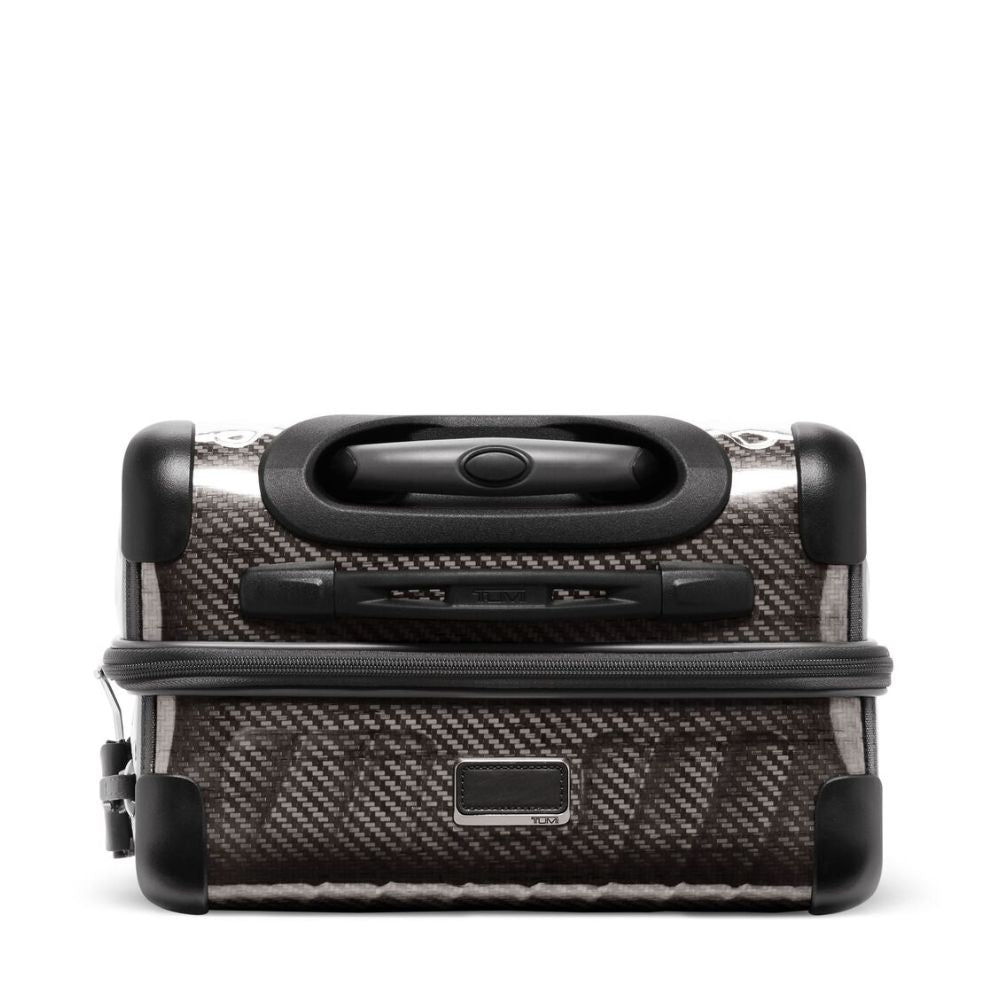 Carbon fiber patterned suitcase with black handle on a white background