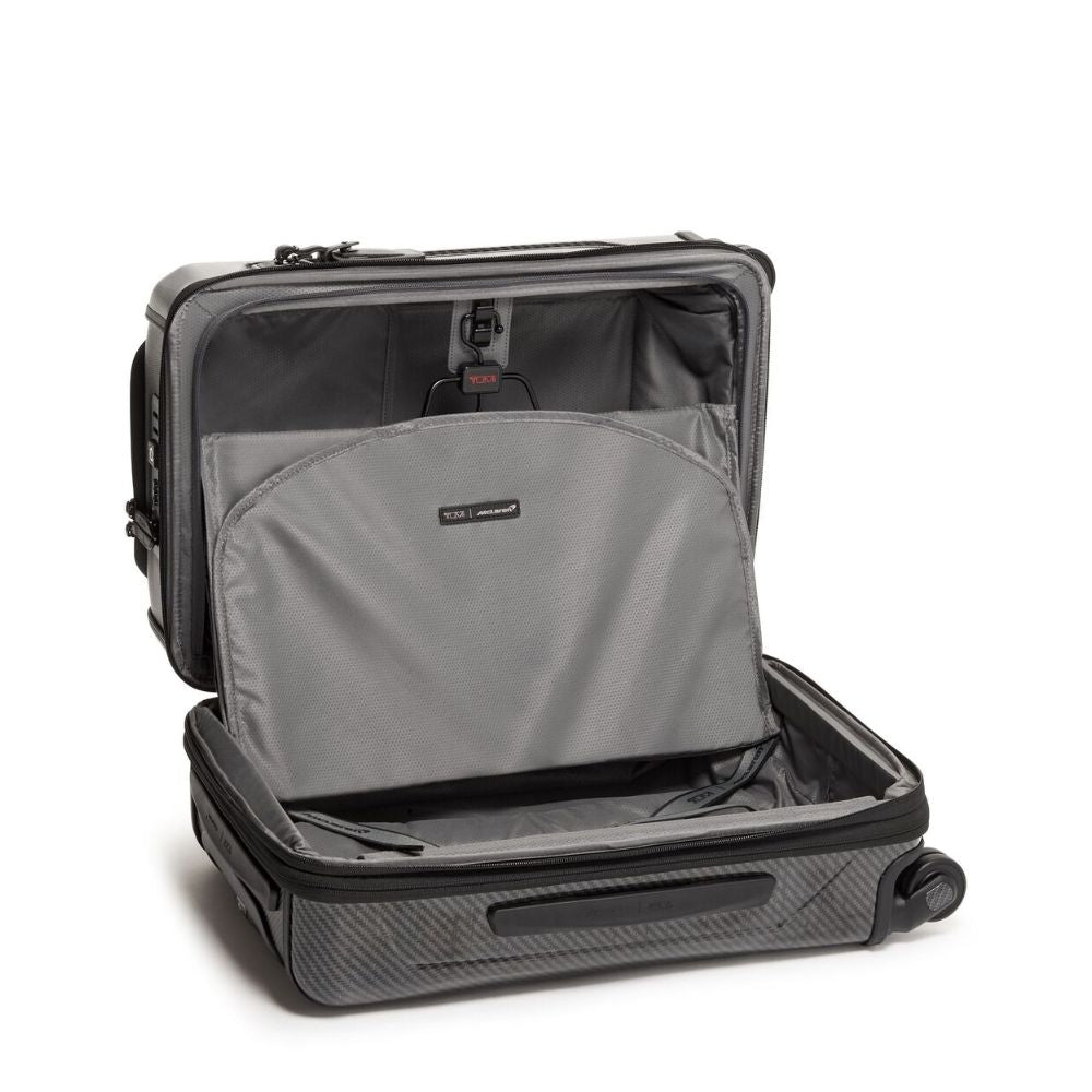 Gray suitcase with open compartment on a white background