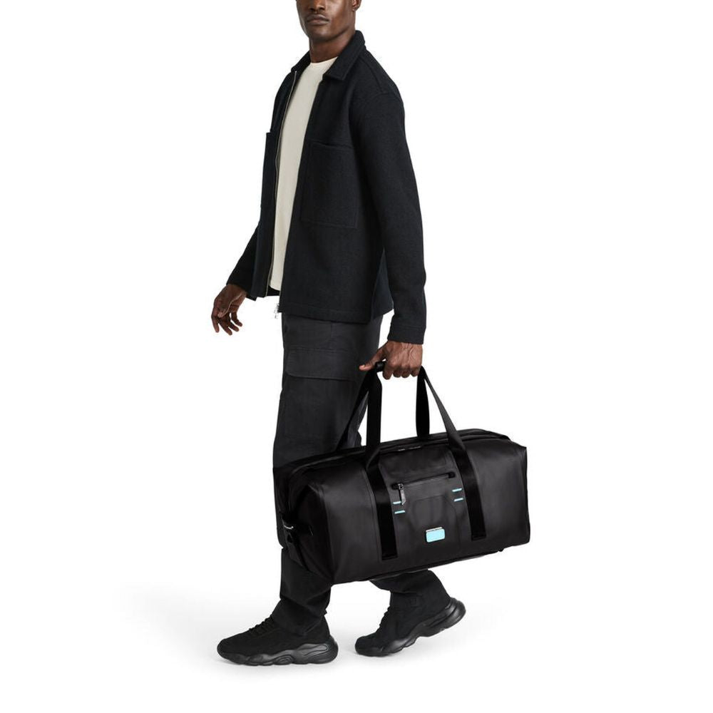 TUMI McLaren Rugged, Versatile, Convertible Throttle Duffel with Tuck-Away Backpack Straps, Welded Construction, Model 150214-1041