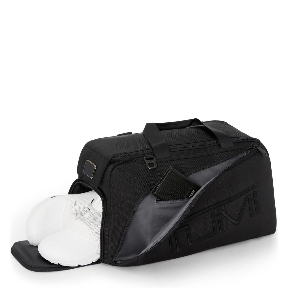 Black sports bag with a clear compartment containing white shoes on a white background