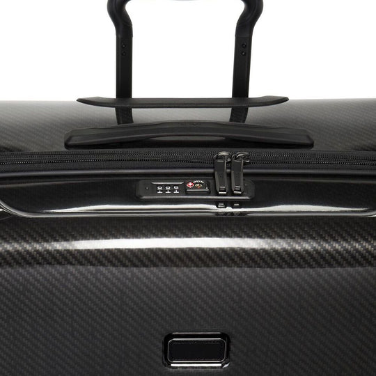 Close up of the handle and combination lock on TUMI Tegra-Lite Extended Packing Case With USB-C And Spinner Wheels: Model Number 144794-1060