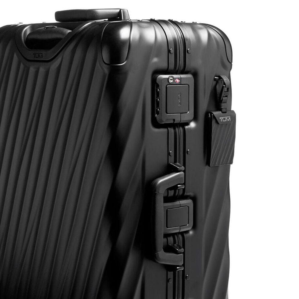 Close up view of the combination lock and handle on TUMI Iconic 19 Degree Black Aluminum Packing Case: Model 98821-1776