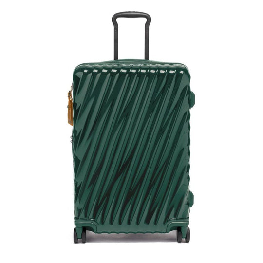 Green suitcase with a pattern on a white background