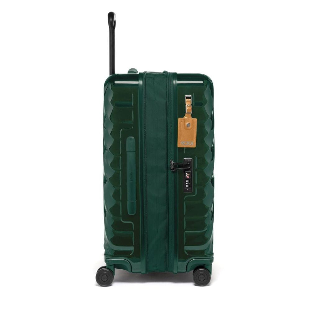 Green suitcase with a visible brand tag on a white background