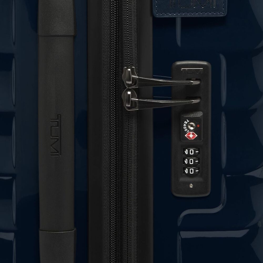 Close-up of a suitcase handle and lock mechanism on navy blue color TUMI 19 Degree Expandable Case