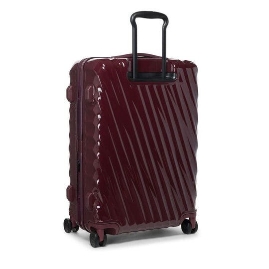 Wine color TUMI 19 Degree Expandable Case with black handle on a white background