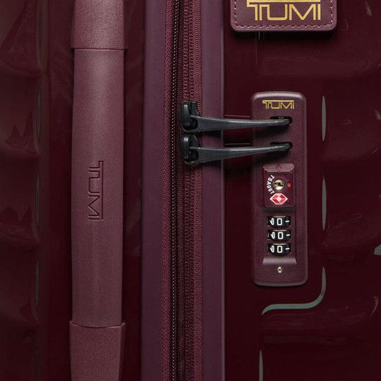 Close-up of a the combination lock on Wine color TUMI 19 Degree Expandable Case
