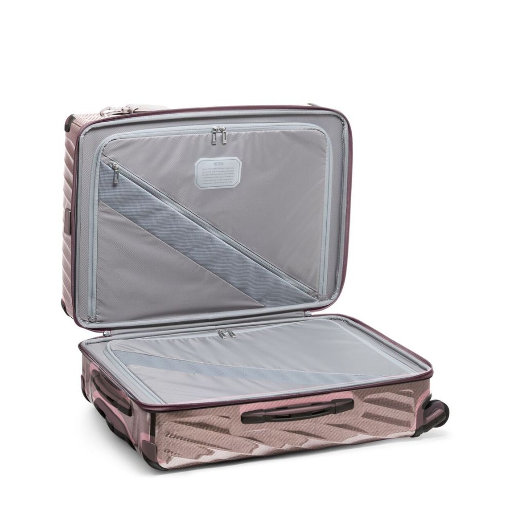 Open suitcase with clear lid on a white background