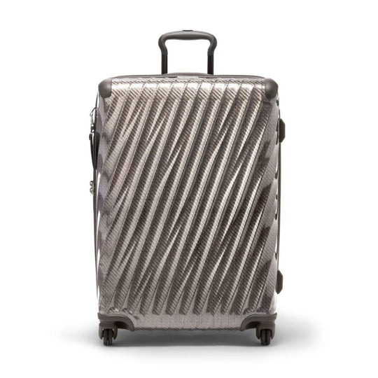 Carbon fiber patterned suitcase on a white background