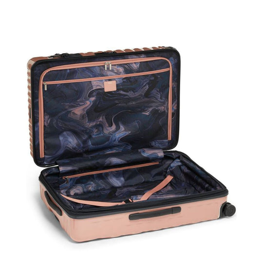 Open suitcase with marbled interior on a white background