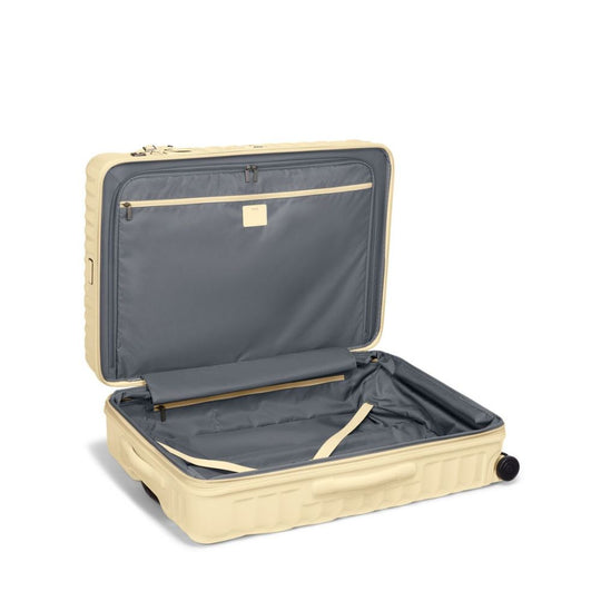 Yellow suitcase with open lid on a white background