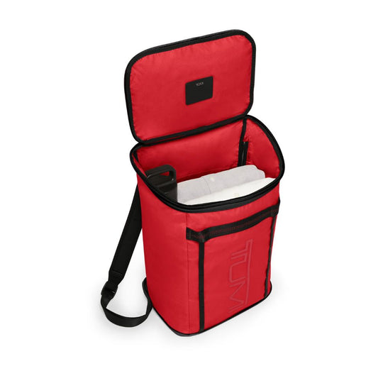 Red cooler bag with black trim on a white background