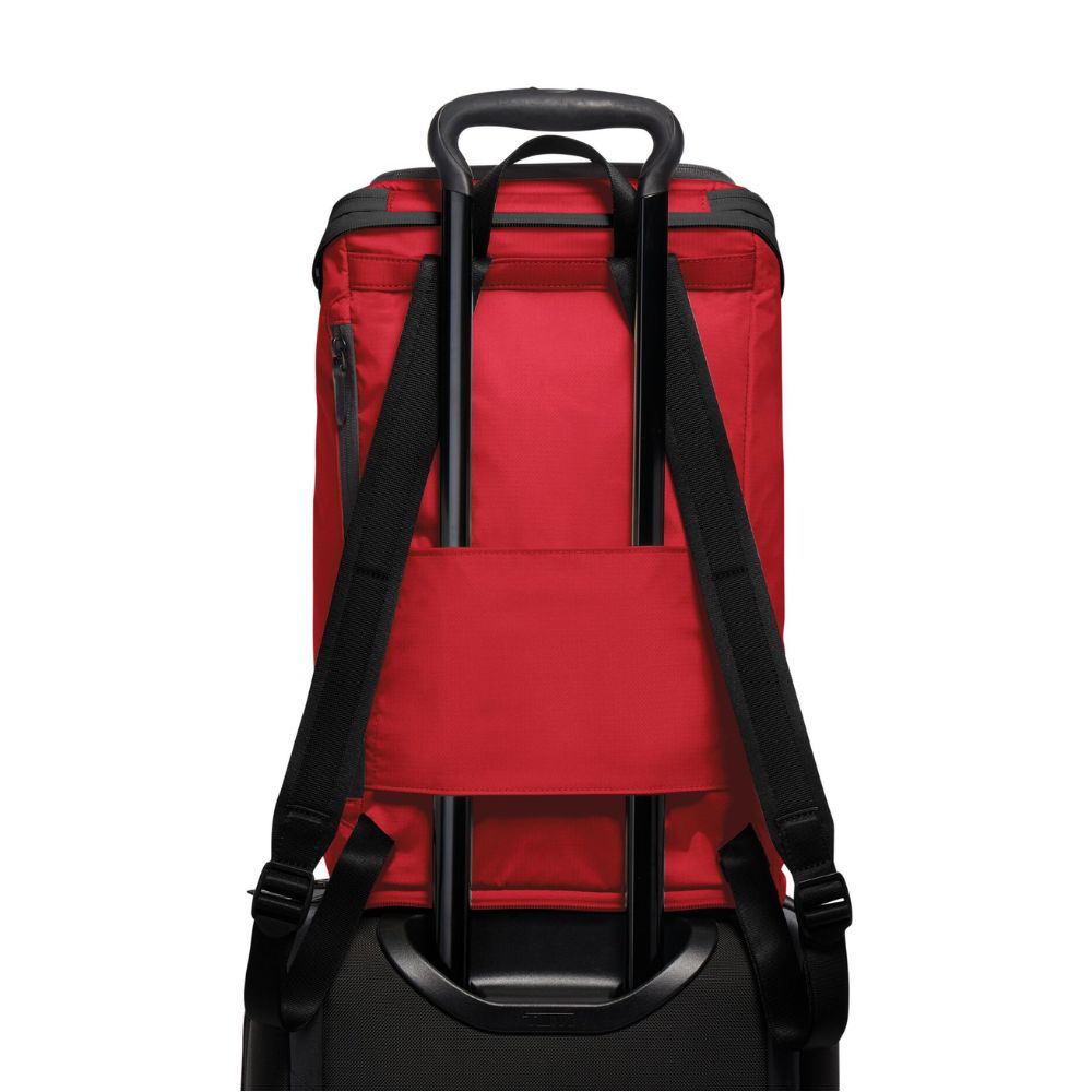 Red backpack with black straps on a white background