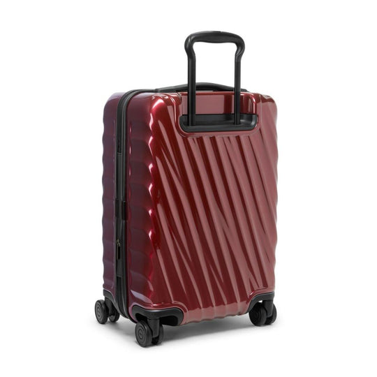 Red suitcase with a black handle on a white background