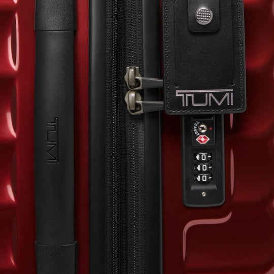 Close up of combination lock on a Red  TUMI Expandable Carry-On (Model 139683-1596)