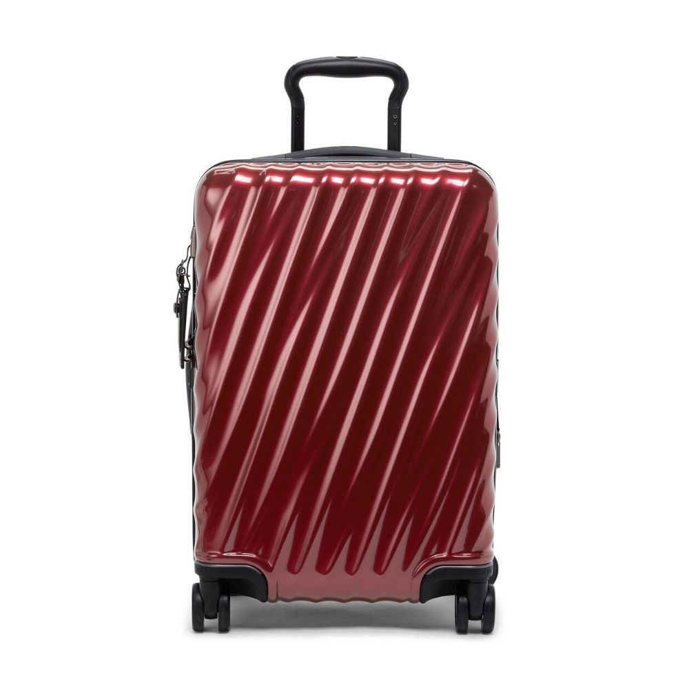 Red suitcase with black handle and wheels on a white background