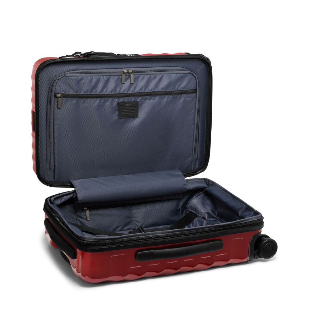 Open red and black suitcase on a white background
