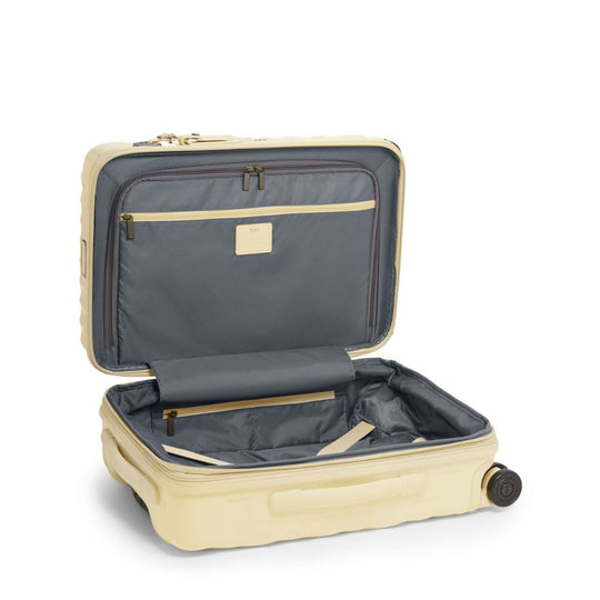 Beige suitcase with open lid on a white background