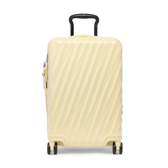 Beige suitcase with a textured surface on a white background