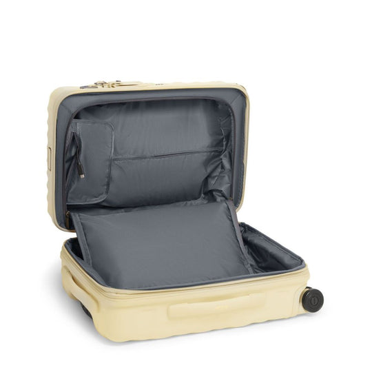Beige suitcase with open lid on a white background