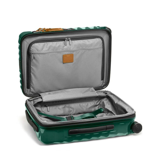 Green suitcase with open lid on a white background