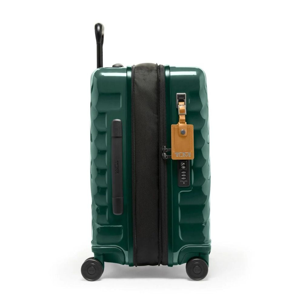 Green suitcase with a visible brand tag on a white background