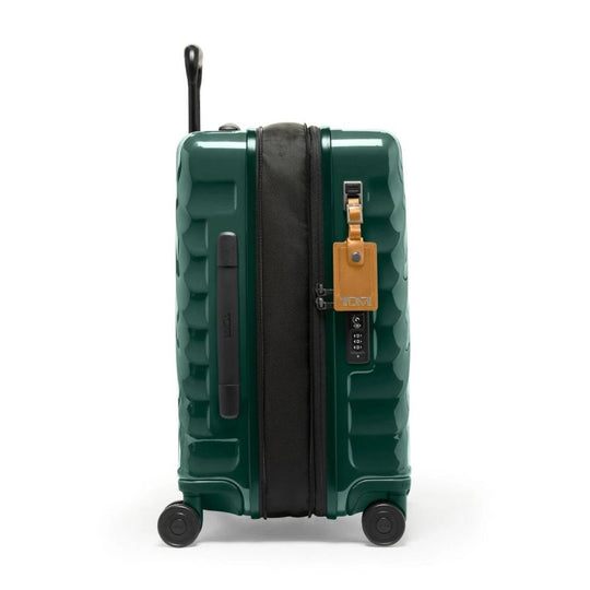 Green suitcase with a visible brand tag on a white background