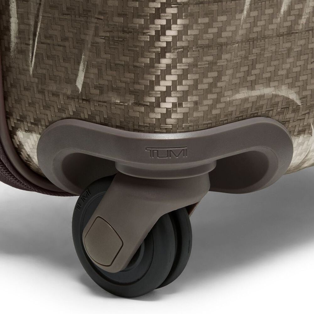 Close-up of a Tumi suitcase wheel on a white background