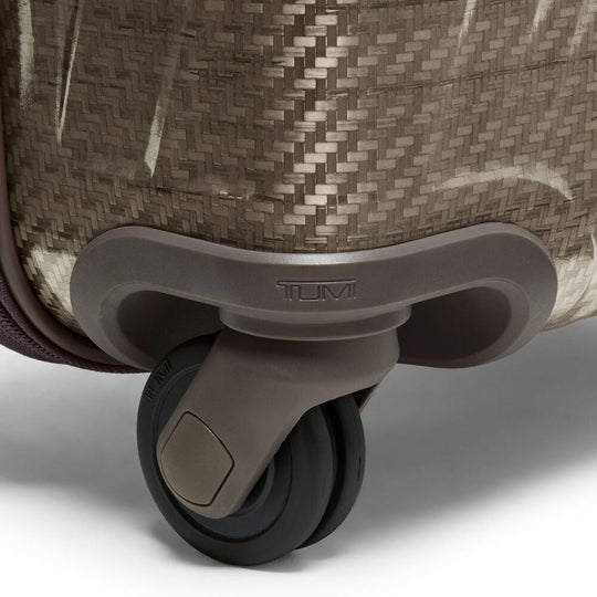 Close-up of a Tumi suitcase wheel on a white background