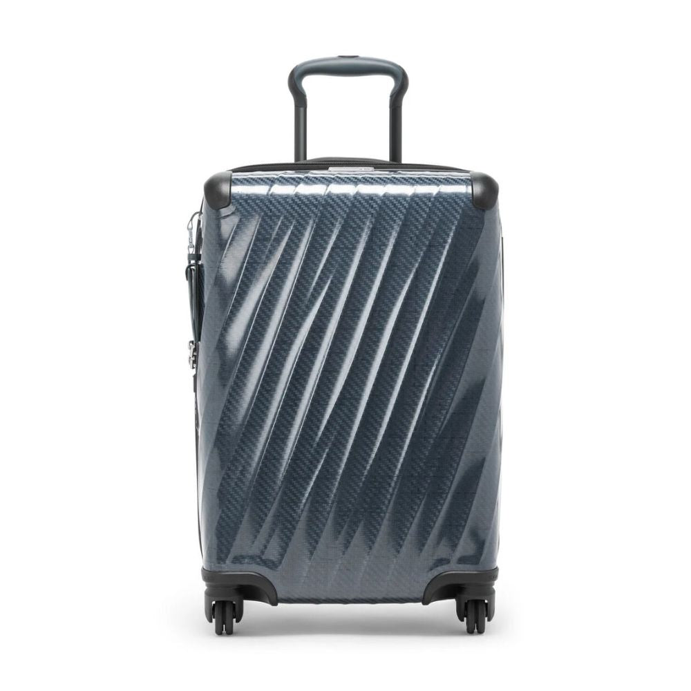 Blue suitcase with a textured pattern on a white background