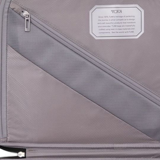 Gray bag with a zipper and Tumi branding