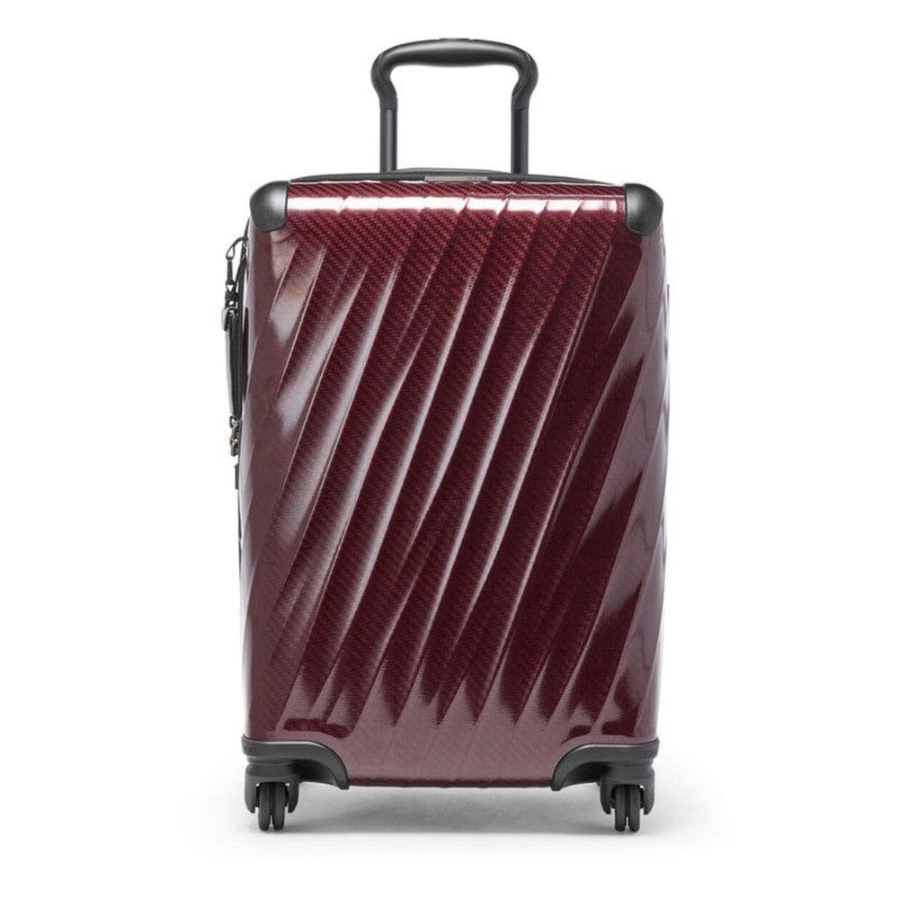 Maroon suitcase with black wheels and handle on a white background