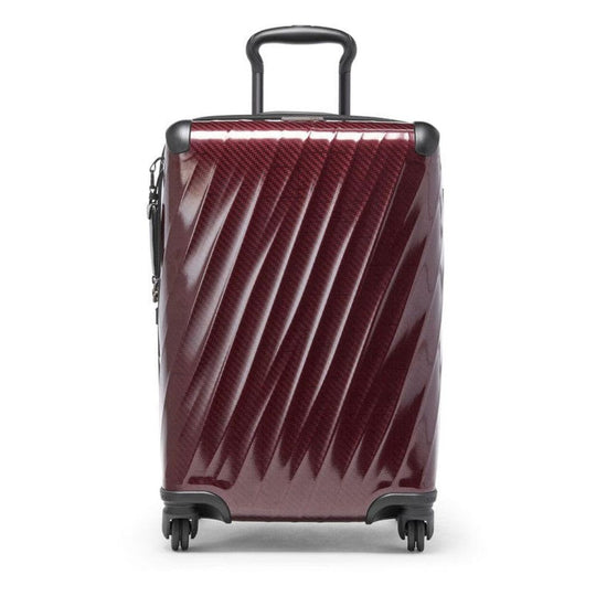 Maroon suitcase with black wheels and handle on a white background