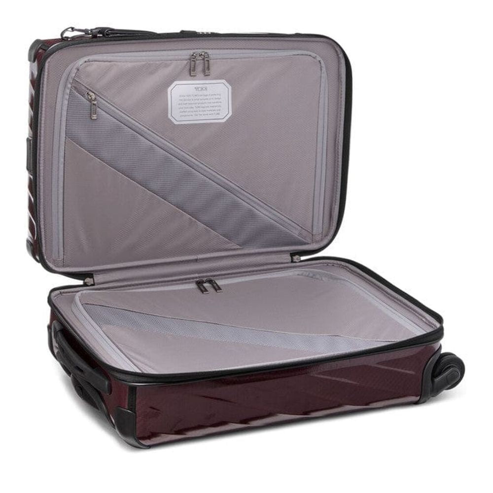 Open suitcase with interior compartments on a white background