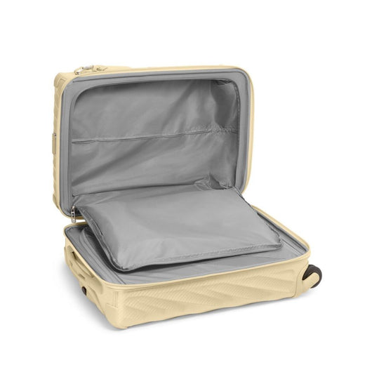 Beige suitcase with open lid on a white background
