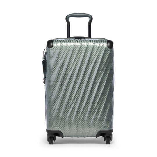 Silver suitcase with a geometric pattern on a white background