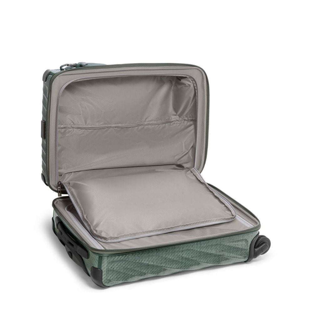 Open green suitcase on a white background