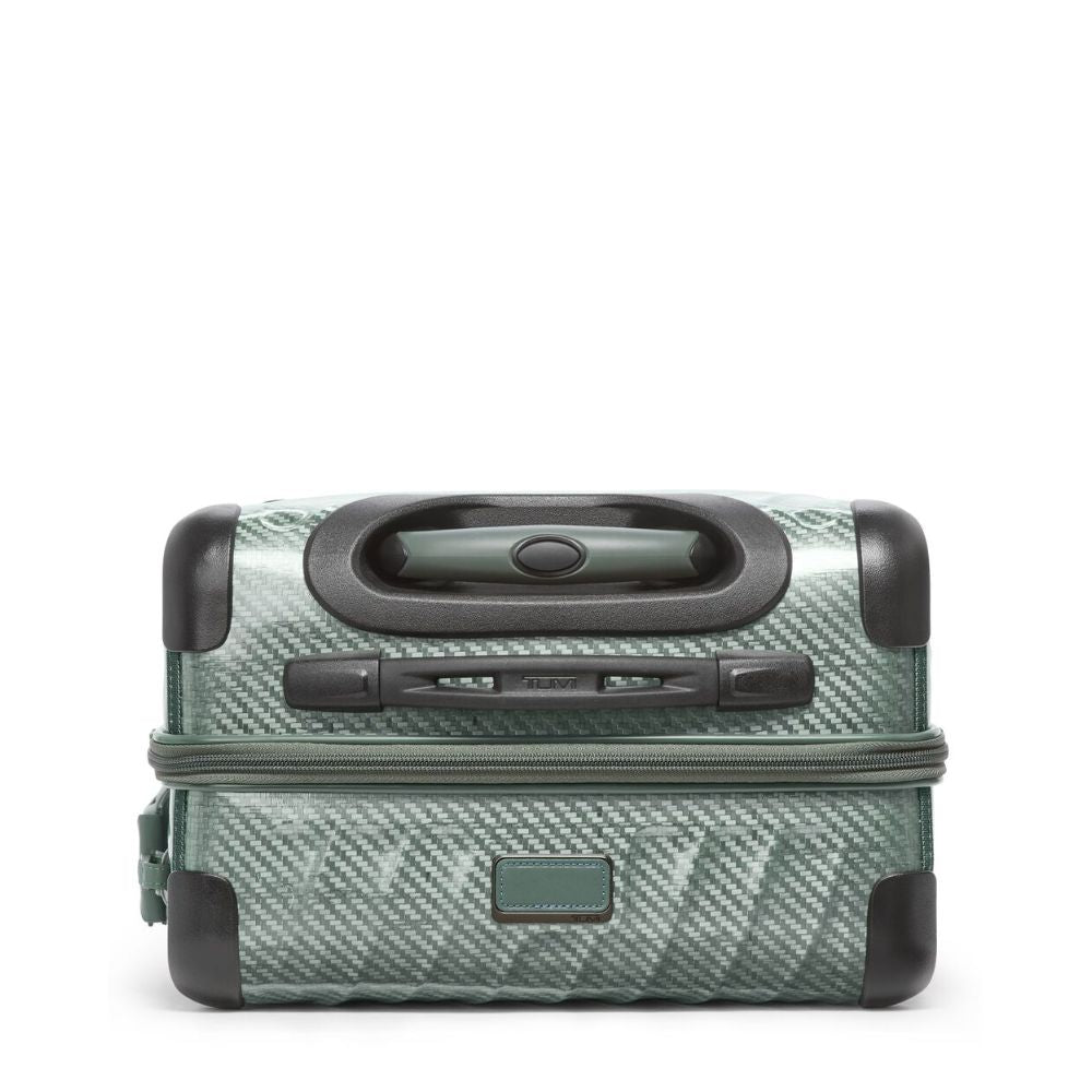 Green suitcase with black handle and wheels on a white background