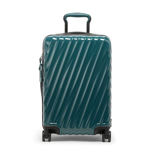 Teal suitcase with a striped pattern on a white background