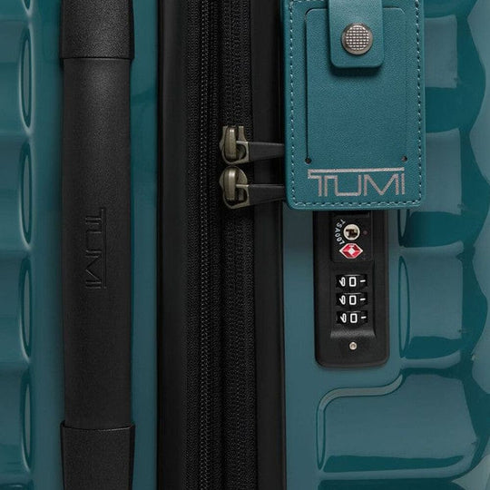 Teal Tumi suitcase with handle and combination lock detail